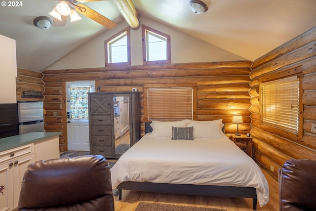 bedroom with log walls, beam ceiling, stainless steel refrigerator, and ceiling fan