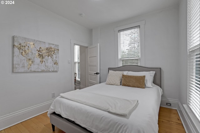 bedroom with light wood-type flooring