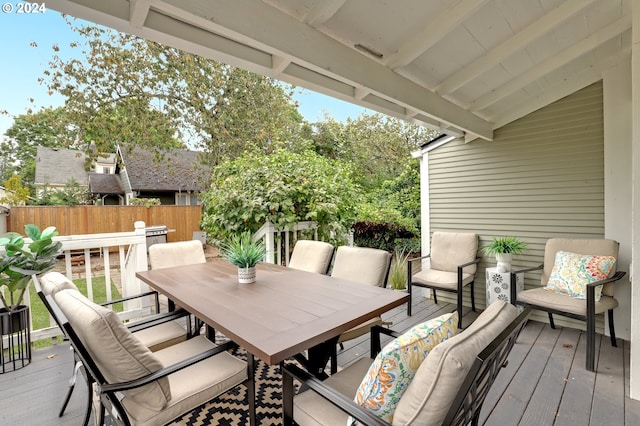 wooden terrace with an outdoor hangout area