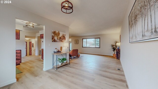 corridor featuring light hardwood / wood-style flooring