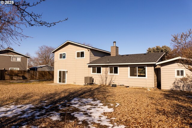 rear view of property with central air condition unit