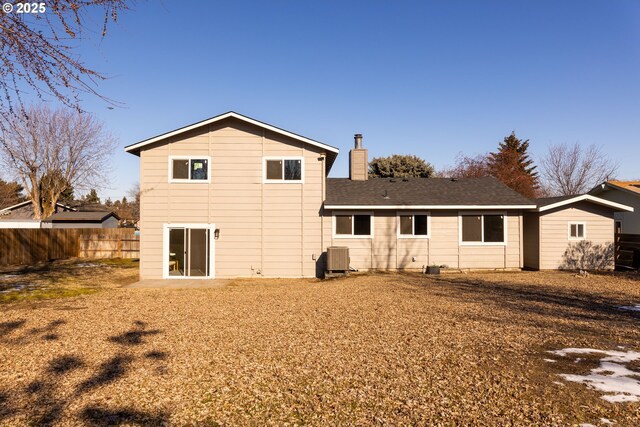 rear view of property featuring central air condition unit