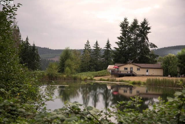 view of water feature featuring a wooded view