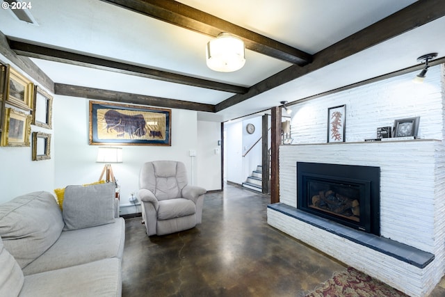 living room featuring beamed ceiling