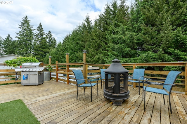 wooden terrace featuring grilling area