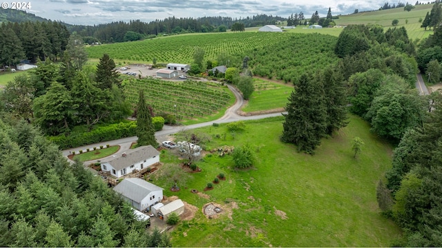 birds eye view of property with a rural view