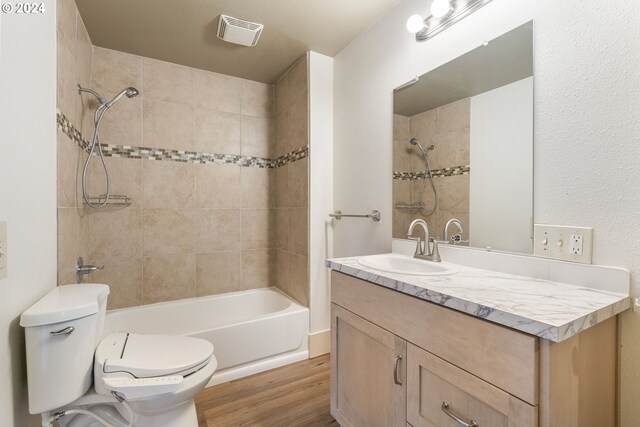 additional living space with a textured ceiling, vaulted ceiling, light carpet, and plenty of natural light