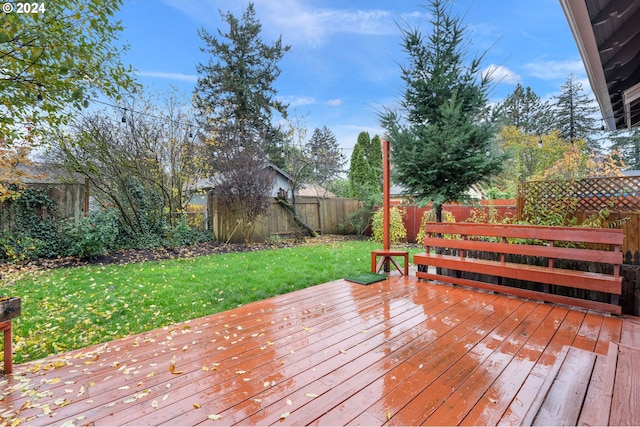 wooden terrace with a yard