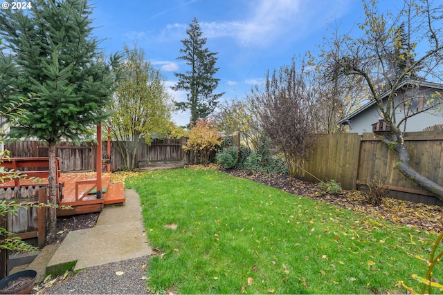 view of yard featuring a wooden deck