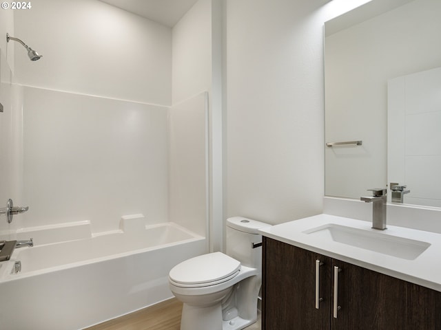 full bathroom with toilet, bathing tub / shower combination, vanity, and hardwood / wood-style flooring