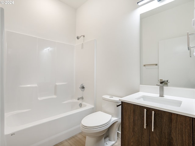 full bathroom with  shower combination, vanity, and toilet