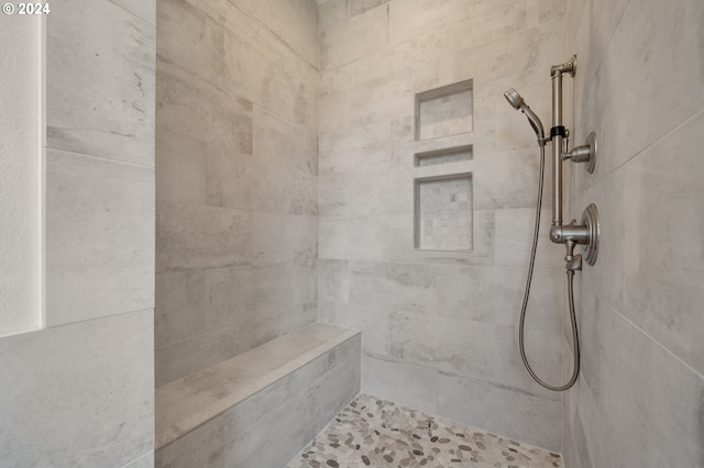 bathroom featuring tiled shower