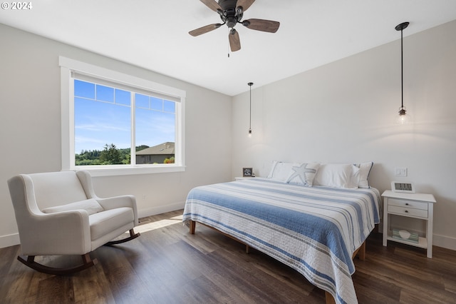 bedroom featuring dark hardwood / wood-style flooring and ceiling fan