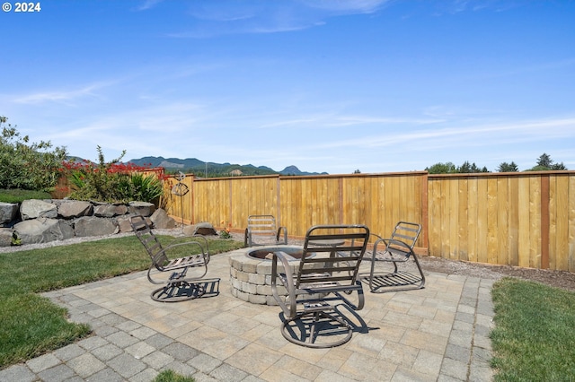 view of patio with a fire pit