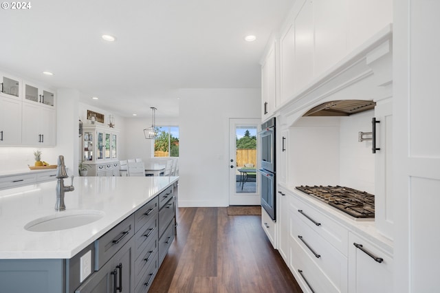 kitchen featuring hanging light fixtures, sink, gray cabinetry, white cabinetry, and dark hardwood / wood-style flooring