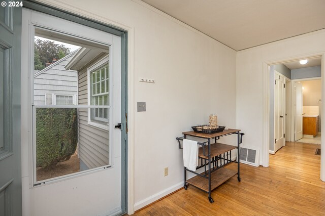 entryway with light hardwood / wood-style floors