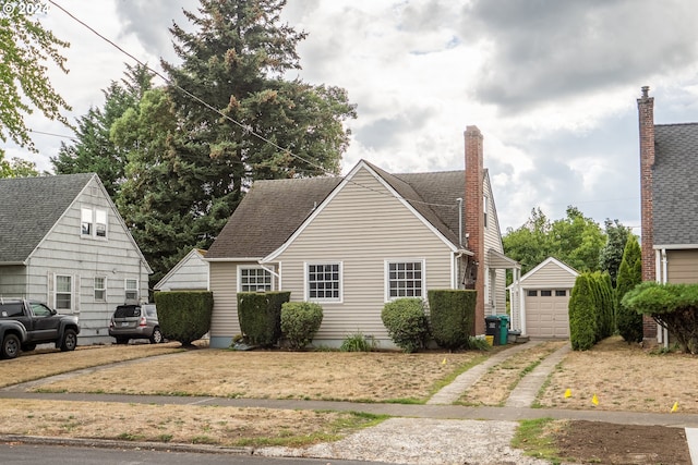 view of front of home featuring an outdoor structure and a garage