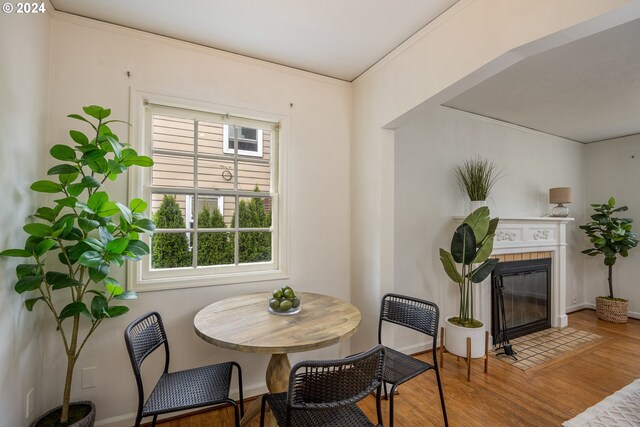 dining room featuring ornamental molding and hardwood / wood-style flooring