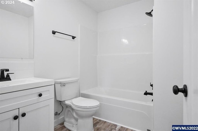 full bathroom featuring shower / bathtub combination, wood-type flooring, toilet, and vanity