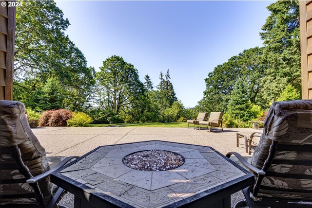 view of patio featuring an outdoor fire pit