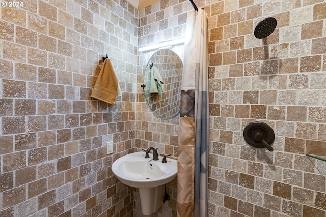 bathroom with tiled shower