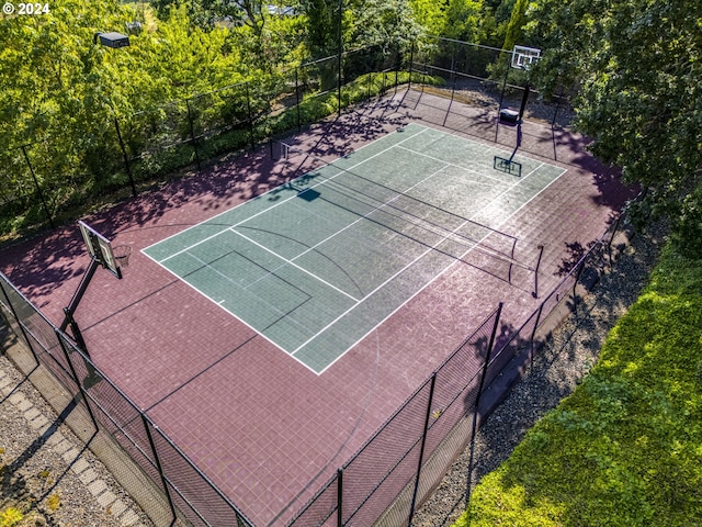 view of tennis court with fence