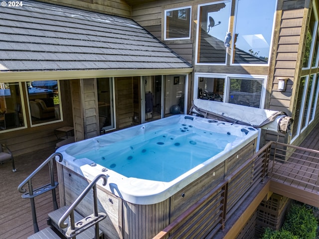 deck with a hot tub