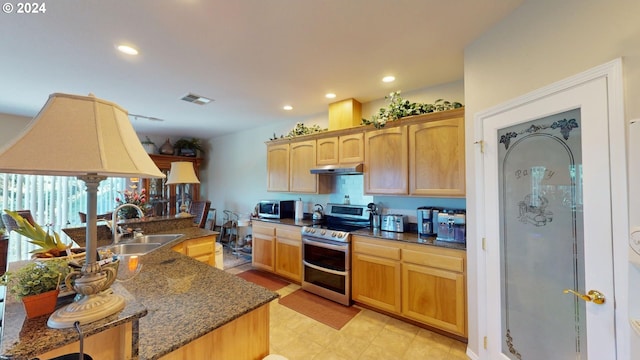 kitchen featuring visible vents, dark stone counters, recessed lighting, under cabinet range hood, and appliances with stainless steel finishes