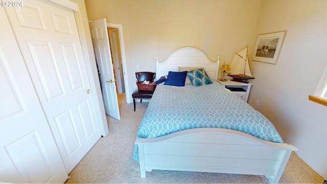 bedroom featuring light colored carpet