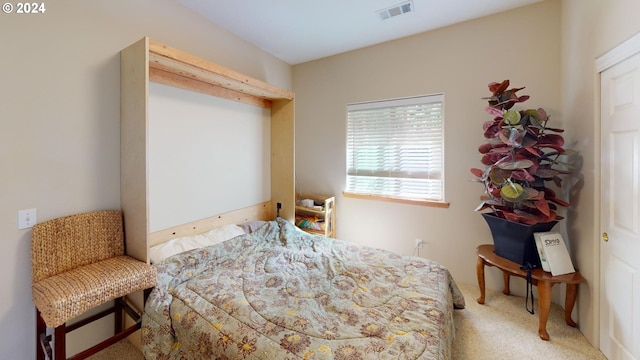 bedroom featuring visible vents and carpet