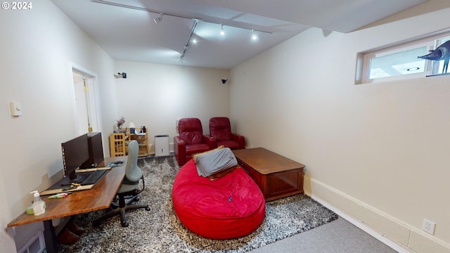 living area with carpet flooring and baseboards