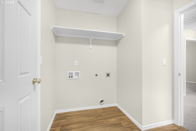 laundry area with hookup for a washing machine, hookup for an electric dryer, laundry area, wood finished floors, and baseboards