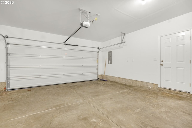 garage with electric panel and a garage door opener