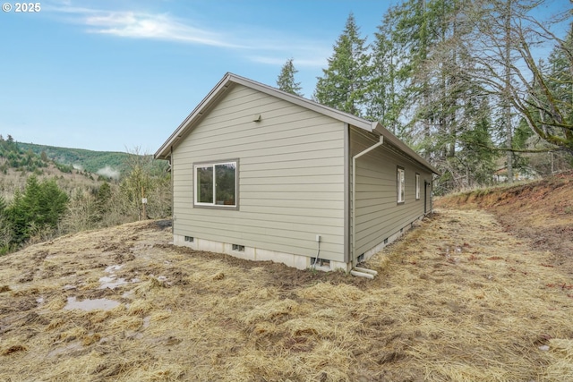 view of property exterior featuring crawl space