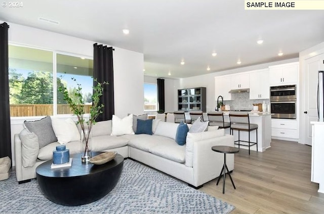 living room with light hardwood / wood-style floors