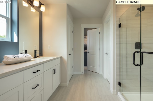 1132 SE 33rd St, Battle Ground, WA 98604 - bathroom featuring vanity, a stall shower, and baseboards