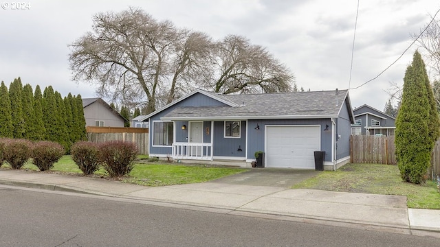 ranch-style house with a front lawn, a porch, and a garage