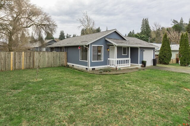 single story home with a front lawn and a garage