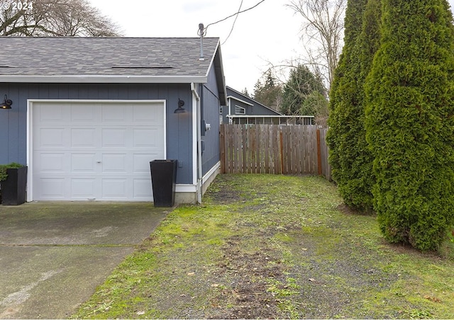 garage with a lawn