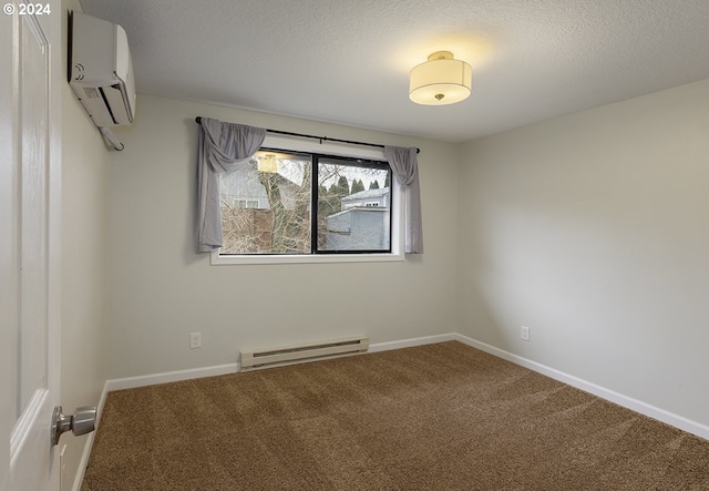 carpeted spare room with an AC wall unit, a baseboard radiator, and a textured ceiling