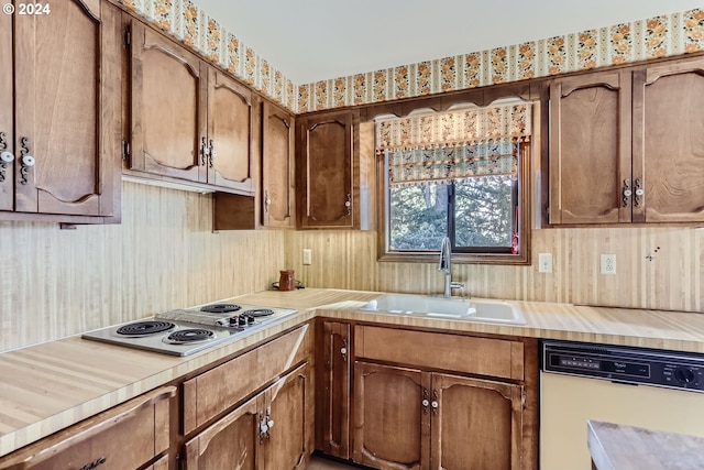 kitchen featuring sink and white appliances