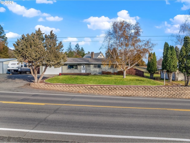 ranch-style house with a front lawn