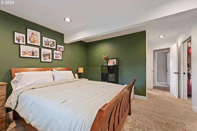 bedroom featuring light carpet