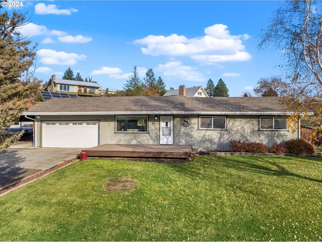single story home featuring a front lawn, roof with shingles, a chimney, concrete driveway, and an attached garage