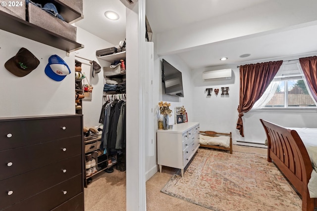 carpeted bedroom featuring a closet, a baseboard heating unit, and a wall unit AC