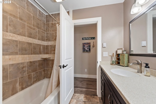 bathroom featuring vanity, shower / bath combination with curtain, and hardwood / wood-style floors