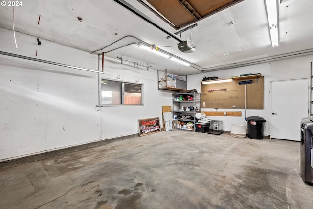 garage featuring a workshop area and a garage door opener