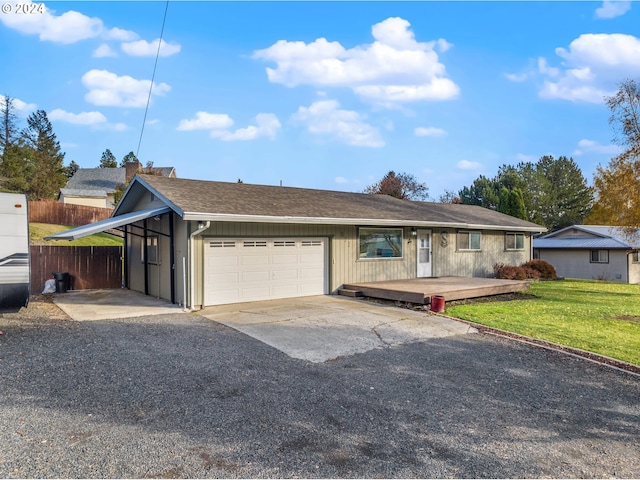 ranch-style house featuring a garage, a front lawn, fence, and concrete driveway