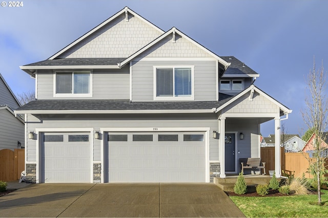 craftsman house with a garage