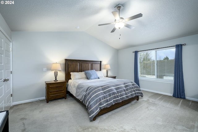 carpeted bedroom featuring ceiling fan and lofted ceiling